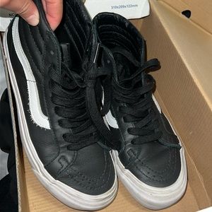 High-top black leather Vans